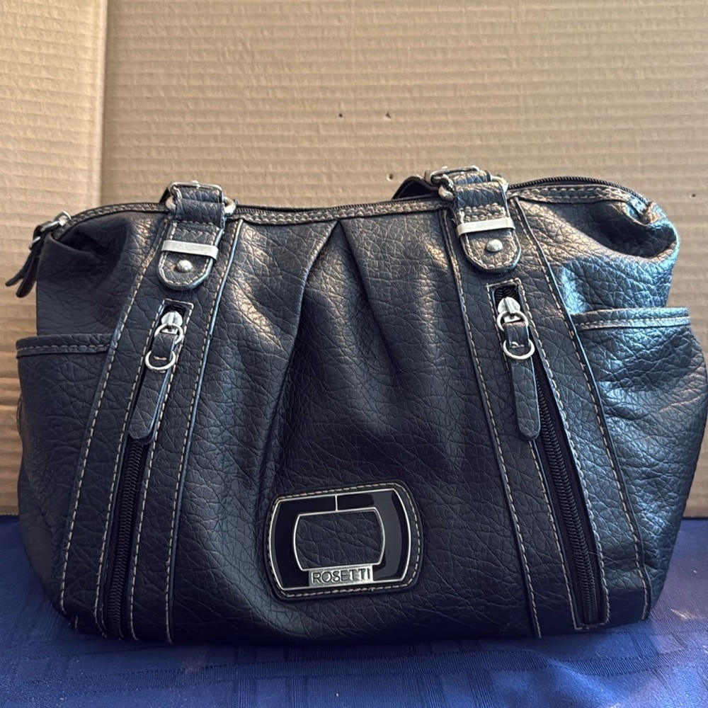 Rossetti black handbag. 11x14. Good condition. Zippers all good.